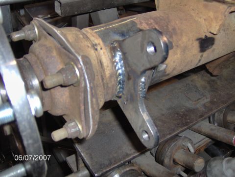 1978 Ford Bronco - Close-up of a rear axle assembly a custom-welded bracket, with a visible date stamp of 06/07/2007.