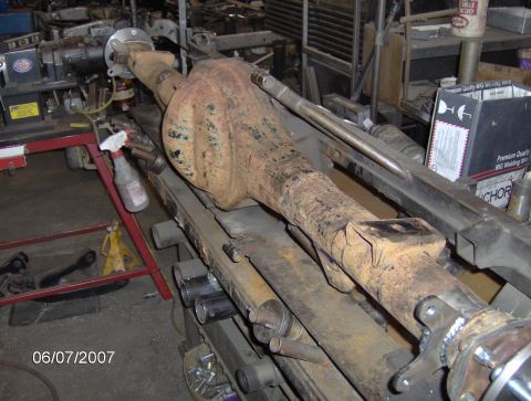 1978 Ford Bronco - A rusty rear axle assembly is shown, likely undergoing modifications or repairs.