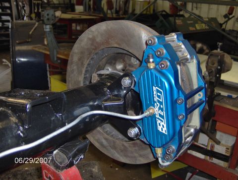 1978 Ford Bronco - Close-up of a blue GRT Race Cars brake caliper installed on a rear axle with a disc brake. The date 06/29/2007 is visible.