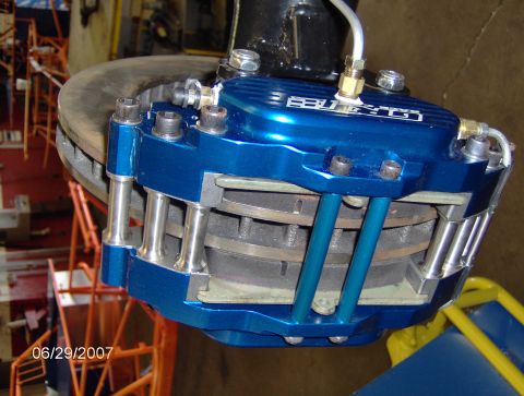 1978 Ford Bronco - Close-up of a blue brake caliper and rotor assembly, with visible text on the caliper. The date 06/29/2007 is also visible.