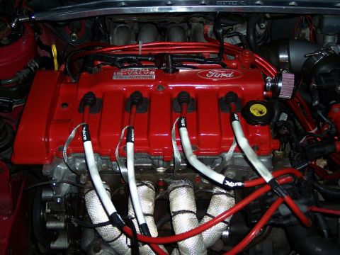 1994 Ford Probe - The engine features a red valve cover with 'Ford' branding and '16-VALVE FUEL INJECTION' text.