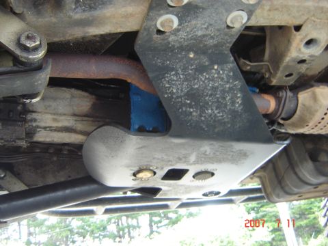 1993 Ford Bronco - Close-up view of the undercarriage, showing skid plates and exhaust system components.