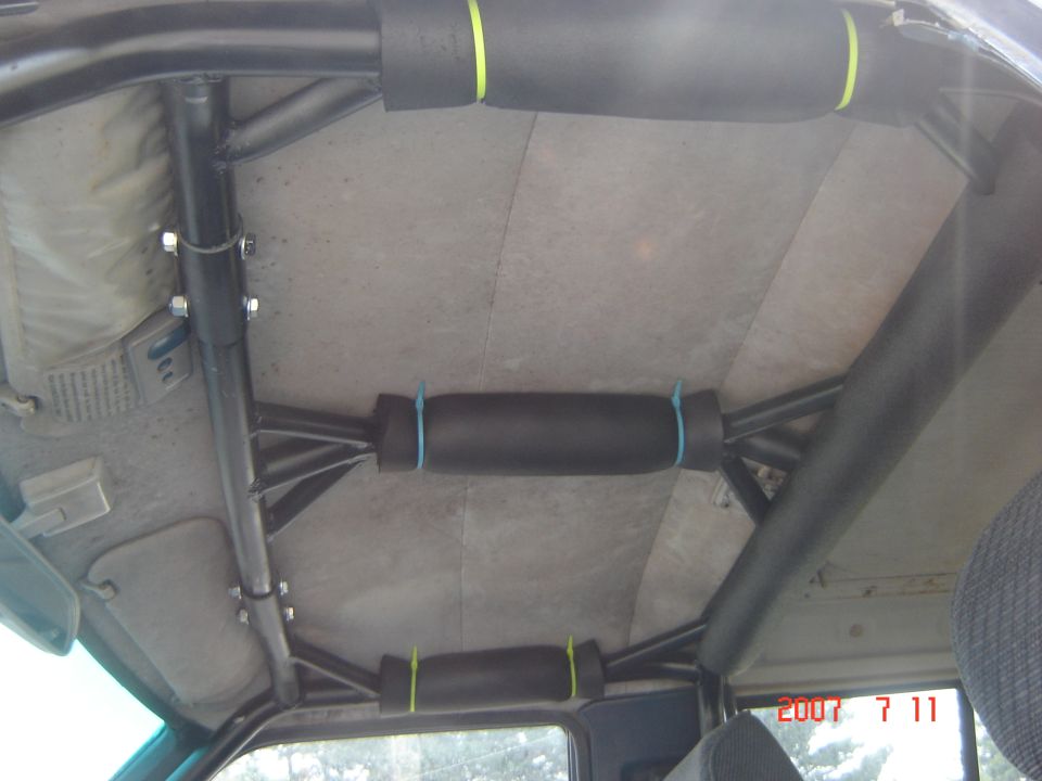 roll cage inside vehicle with padded grab handles