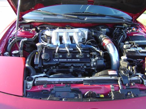 1997 Ford Probe - Engine bay view of a Mazda V6 DOHC 24-valve engine.