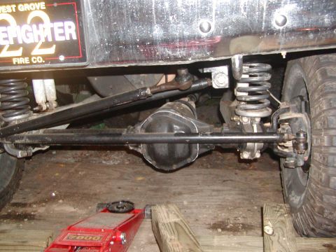 1991 Ford Bronco - Close-up of the rear axle and suspension components on a 1991 Ford Bronco.