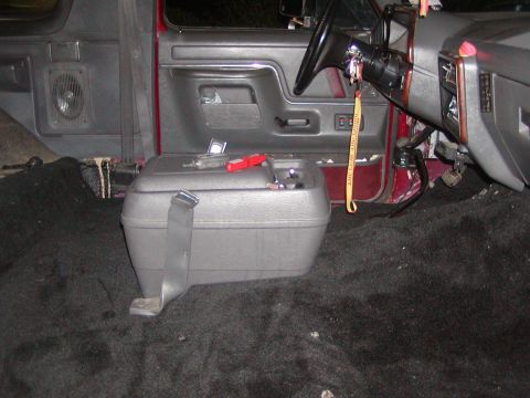 1991 Ford Bronco - Interior view of a 1991 Ford Bronco with carpet removed and center console in place.