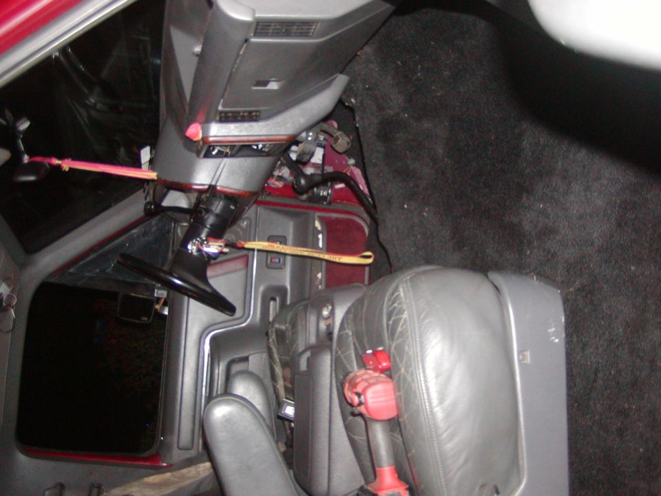 1991 Ford Bronco interior showing steering wheel, seats, and carpet