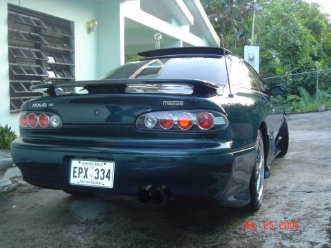 1995 Mazda MX-6 - Rear view of a 1995 Mazda MX-6 showing its distinctive taillights and quad exhaust pipes.