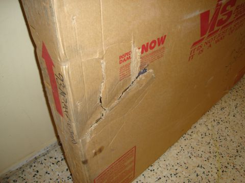 1995 Mazda MX-6 - Cardboard box shows damage and shipping instructions.