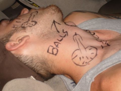 1992 Ford Bronco - A man's face and neck are covered in crude drawings and text, suggesting a drunken prank.