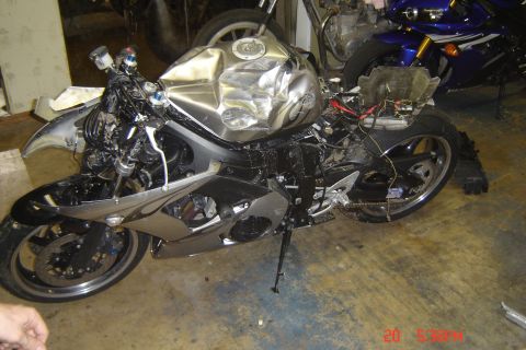 2006 Honda CBR-RR - Brother lost the front wheel doing - 100 and the bike slide into a cement wall. Other side.