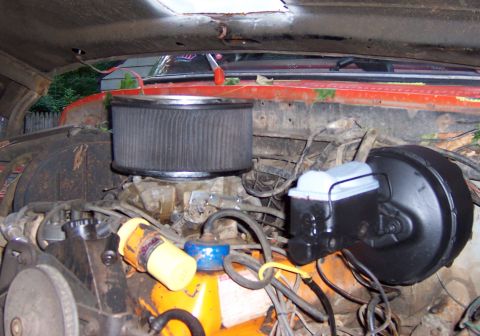 1978 Ford Bronco - Close-up view of the engine compartment, highlighting the air intake and brake system components.