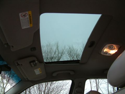 2002 Ford Crown Victoria - Interior view of a car, focusing on the sunroof and surrounding cabin elements.