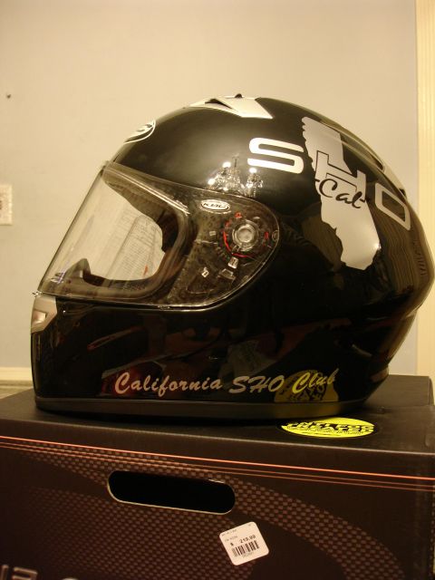 1993 Ford Taurus - A black motorcycle helmet features "SHO" and California map graphics, along with "California SHO Club" text on the side.