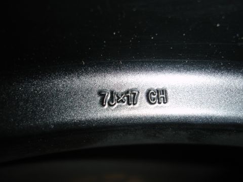1993 Ford Taurus - Close-up of a wheel showing the size and markings '7Jx17 CH'.