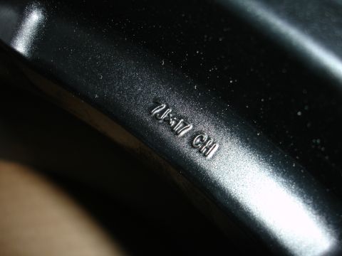 1993 Ford Taurus - Close-up of a black wheel rim showing embossed size and code markings.
