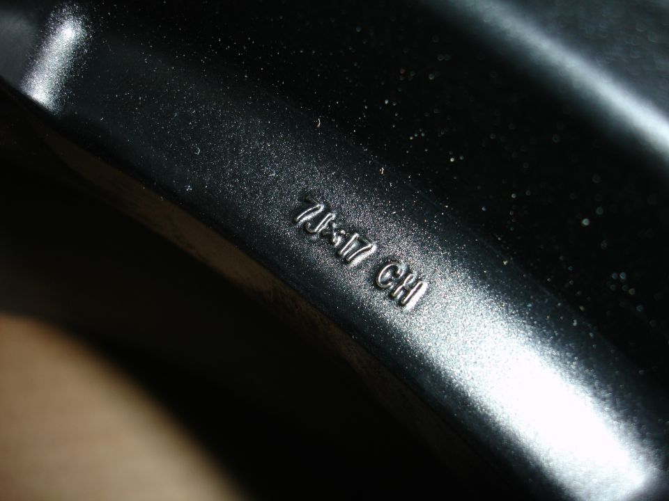 Black wheel rim with embossed text 'ZJ5-17 CH'
