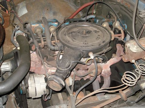 1979 Chevrolet C/K Pickup - The engine bay shows a V8 engine with various components including the air cleaner and alternator.
