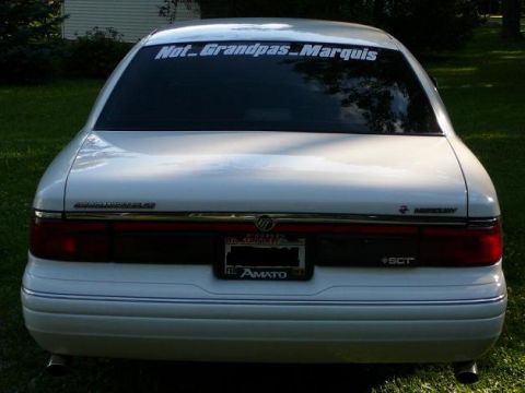 1997 Mercury Grand Marquis - Rear view of a white 1997 Mercury Grand Marquis sedan parked outdoors.
