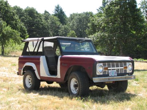 1968 Ford Bronco - A 1968 Ford Bronco with a removable top sits in a grassy field.
