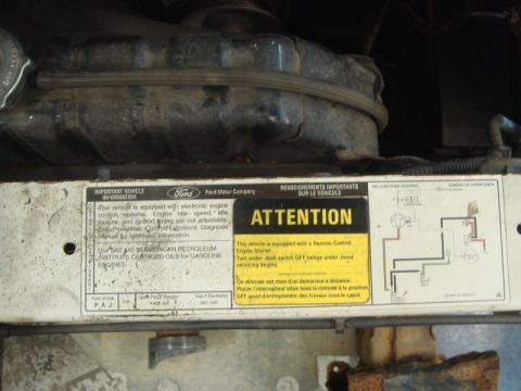 1996 Ford Bronco - A label on a vehicle's engine compartment provides important information and a warning about a remote engine starter.