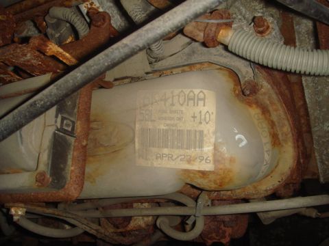 1996 Ford Bronco - A label on a rusty engine component indicates it was manufactured in April 1996.