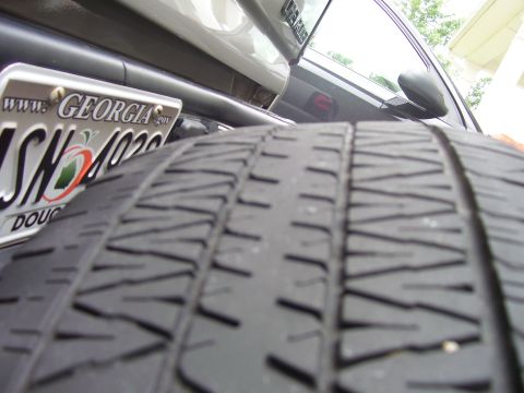 2004 Chevrolet Silverado 1500 - Spare tire and Georgia license plate from a vehicle.