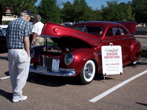 1972 Ford Ranchero - A custom-built 1939 Mercury coupe is displayed with its hood and trunk open at a car show.