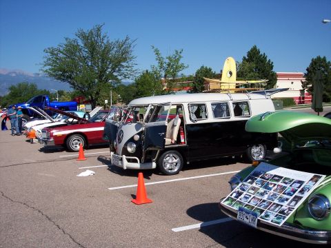 1972 Ford Ranchero - A collection of vehicles are displayed at an outdoor event under a clear blue sky.