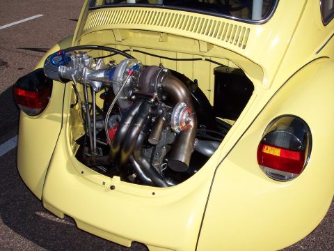 1972 Ford Ranchero - A custom turbo engine is installed in the rear of a yellow Volkswagen Beetle.