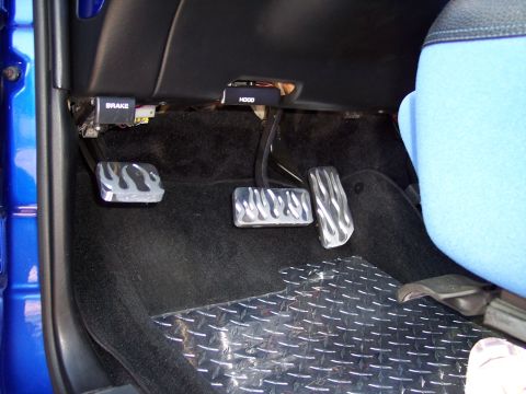 1972 Ford Ranchero - Custom pedals and floor mat are visible inside a vehicle's cabin.