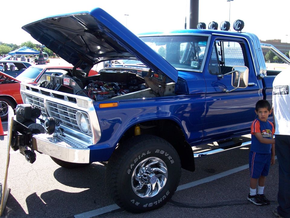Blue pickup truck with hood open, showing engine. Year 1972