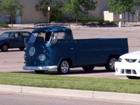 1972 Ford Ranchero - Blue Volkswagen Type 2 pickup truck parked in a lot.