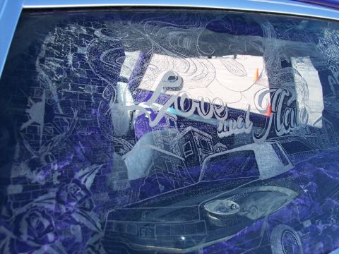 1972 Ford Ranchero - Rear window features intricate etching of text, cityscape, and floral designs.