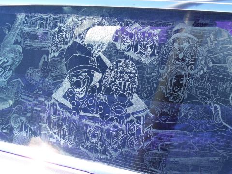 1972 Ford Ranchero - A custom engraved panel displays a scene with clowns, women, and vintage cars.