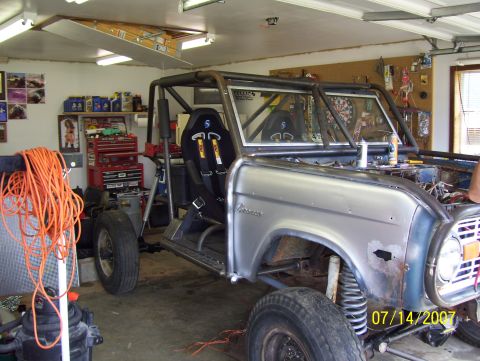 1978 Ford Bronco - This 1978 Ford Bronco has been heavily modified with a roll cage and racing seats, seen here in a garage setting.