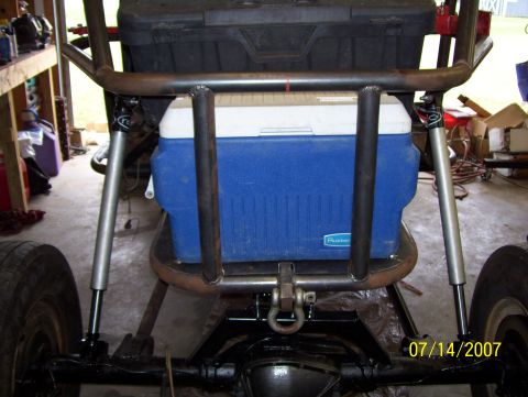 1978 Ford Bronco - Rear view of a custom off-road vehicle, a blue cooler and a black toolbox mounted behind the roll cage.