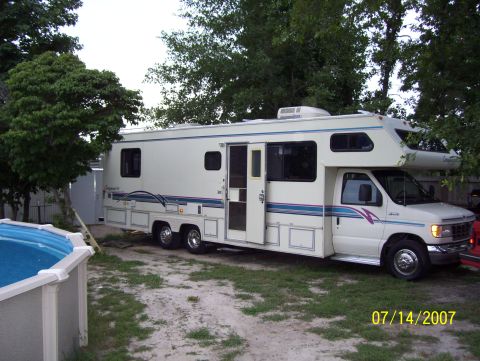1978 Ford Bronco - Motorhome parked in a yard with a pool. The image is dated 07/14/2007.