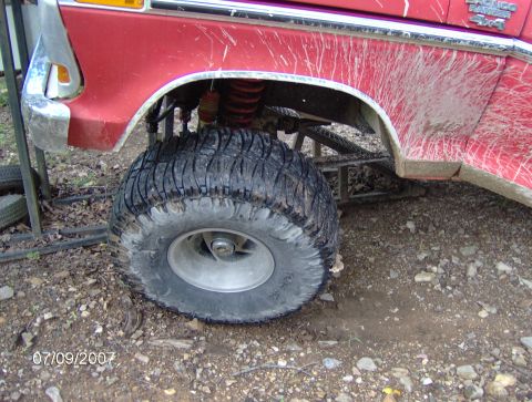 1978 Ford Bronco - This lifted 1978 Ford Bronco Ranger 4x4 is covered in mud splatters, showing its off-road capabilities.