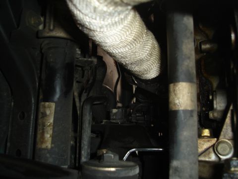 1995 Mazda MX-6 - Close-up view of engine bay components, including an insulated hose and plumbing.