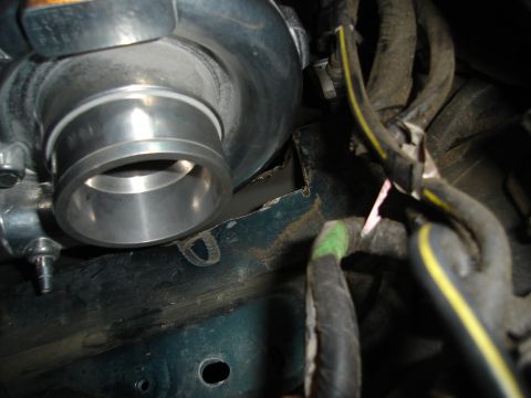 1995 Mazda MX-6 - Close-up of a turbocharger intake pipe, part of an engine modification project.