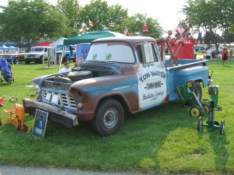 1974 Ford Ranchero - This tow truck, resembling the character Mater from the movie Cars, is on display at an outdoor event.