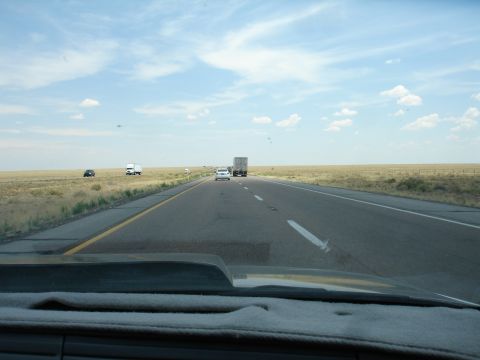 1993 Ford Taurus - View from inside a vehicle driving on a highway with other cars and trucks on a clear day.