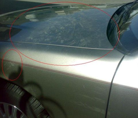 2007 Mercury Grand Marquis - Close-up of a car's hood and fender showing dust and scratches, with red circles highlighting damaged areas.