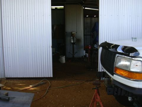 1995 Ford Bronco - Front view of a 1995 Ford Bronco's grille and headlight assembly.