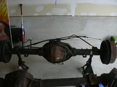 1995 Ford Bronco - This is a rear axle assembly, likely from a truck or SUV, resting on jack stands.