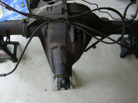 1995 Ford Bronco - A rear axle assembly, likely from a truck or SUV, is shown supported by jack stands.