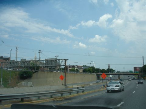 1993 Ford Taurus - Driving on a highway with construction and the Gateway Arch in the background.