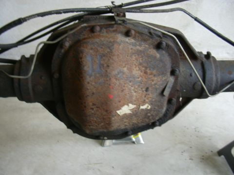 1995 Ford Bronco - Close-up of a rusty rear axle differential assembly, likely removed from a vehicle.