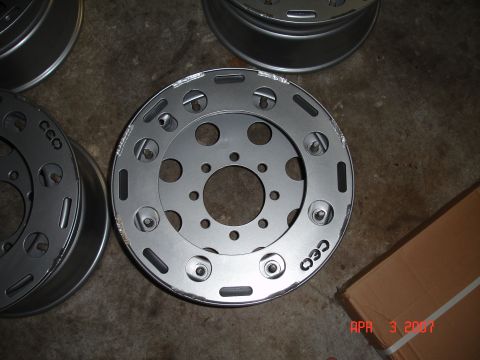 1995 Ford Bronco - Close-up of aftermarket wheels, possibly for a truck or SUV, with visible branding.